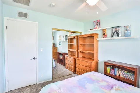 a bedroom with a bed and closet