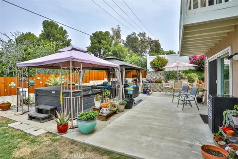 a view of an chairs and tables in the patio