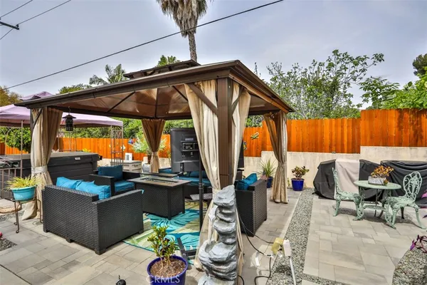 a outdoor living space with patio furniture and potted plants