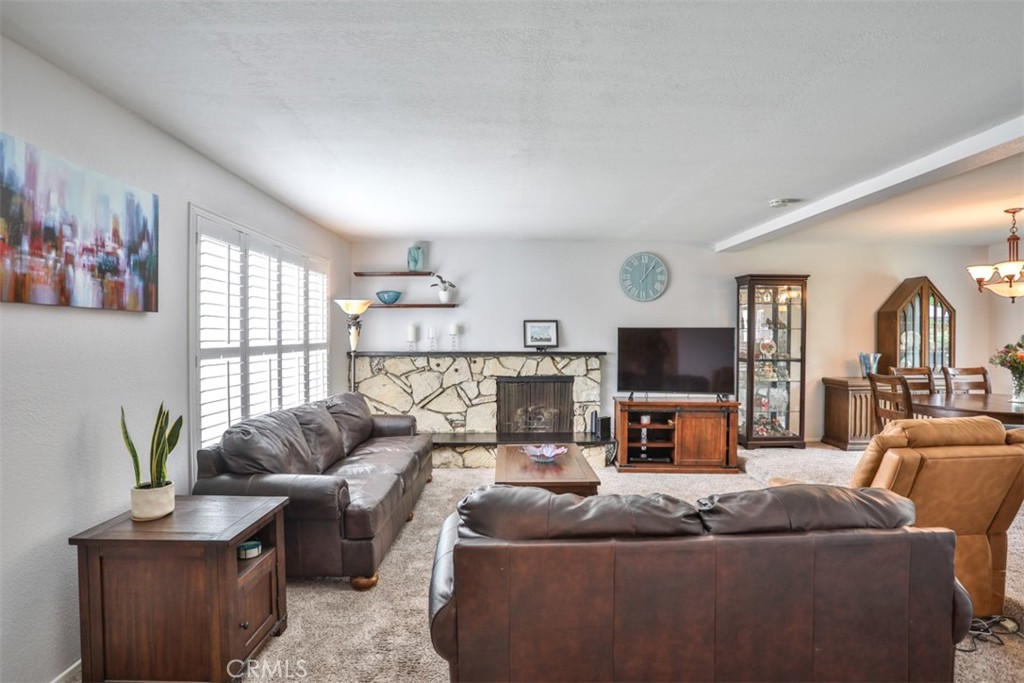 321 Blossom Place Brea, CA 92821 - Photo 6 of 48 a living room with furniture and a flat screen tv