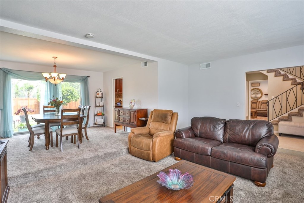321 Blossom Place Brea, CA 92821 - Photo 9 of 48 a living room with furniture kitchen view and a wooden floor