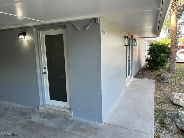 a backyard of a house with plants and trees