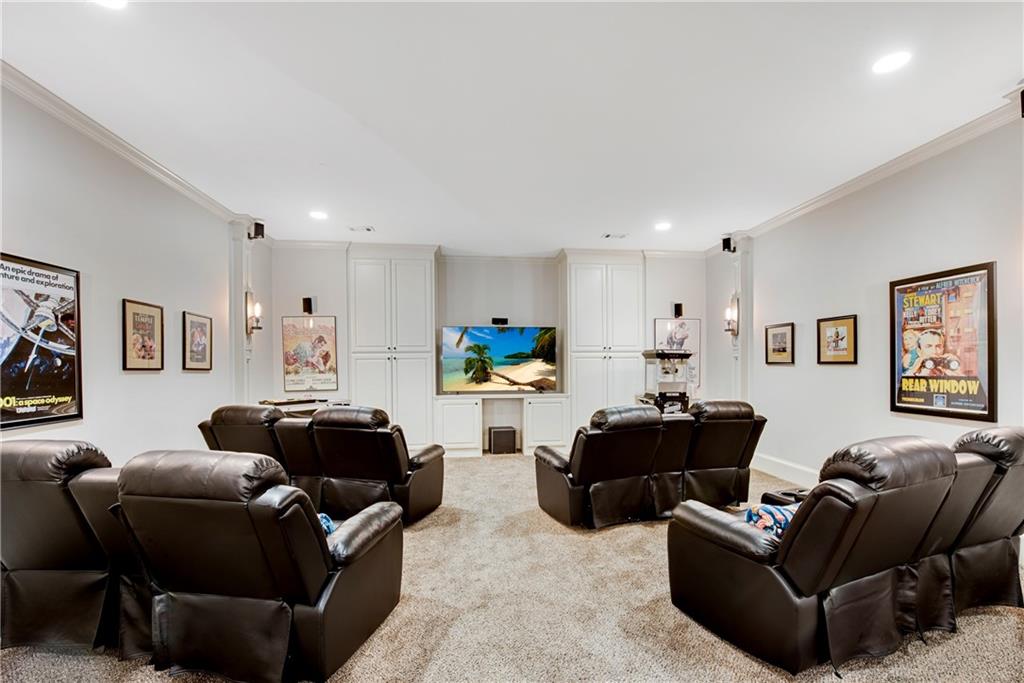 13942 Tree Loft Road Milton, GA 30004 - Photo 68 of 102 a living room with furniture a couch and a wall painting