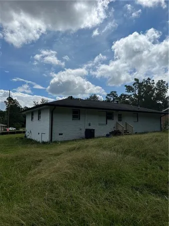 a backyard of a house with lots of green space