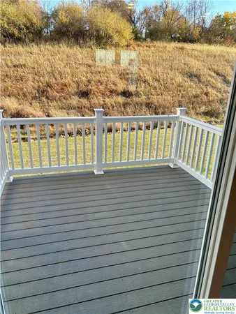 a view of a balcony next to a lake view
