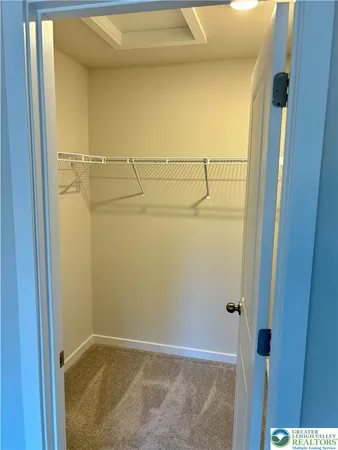 a view of storage and utility room with racks on the wall