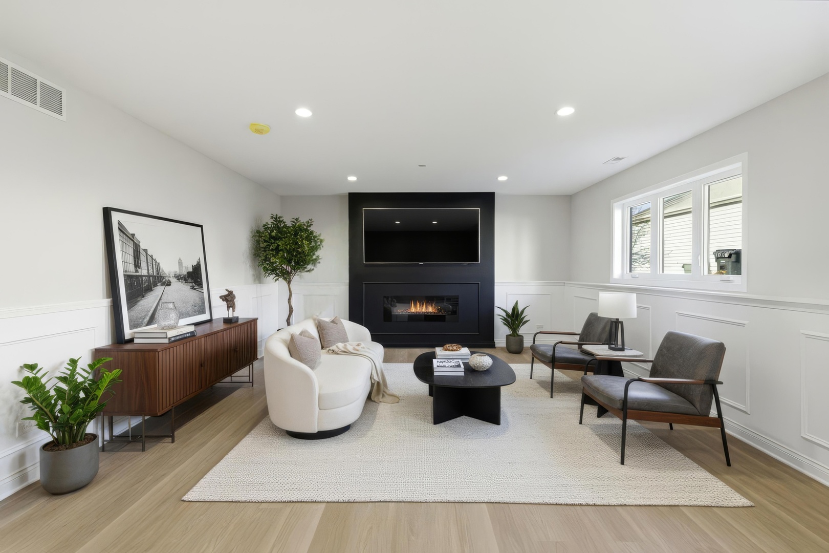 8332 South 77th Court Bridgeview, IL 60455 - Photo 11 of 26 a living room with furniture potted plant and a fireplace