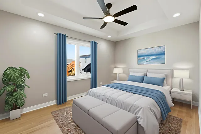 a bedroom with a large bed and a window