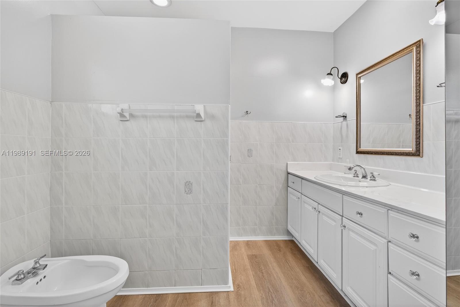 2431 Southwest 4th Street Miami, FL 33135 - Photo 17 of 33 a bathroom with a sink a toilet and shower