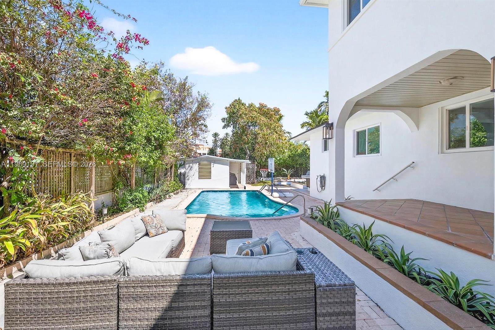 2431 Southwest 4th Street Miami, FL 33135 - Photo 18 of 33 a view of a patio with couches table and chairs and potted plants