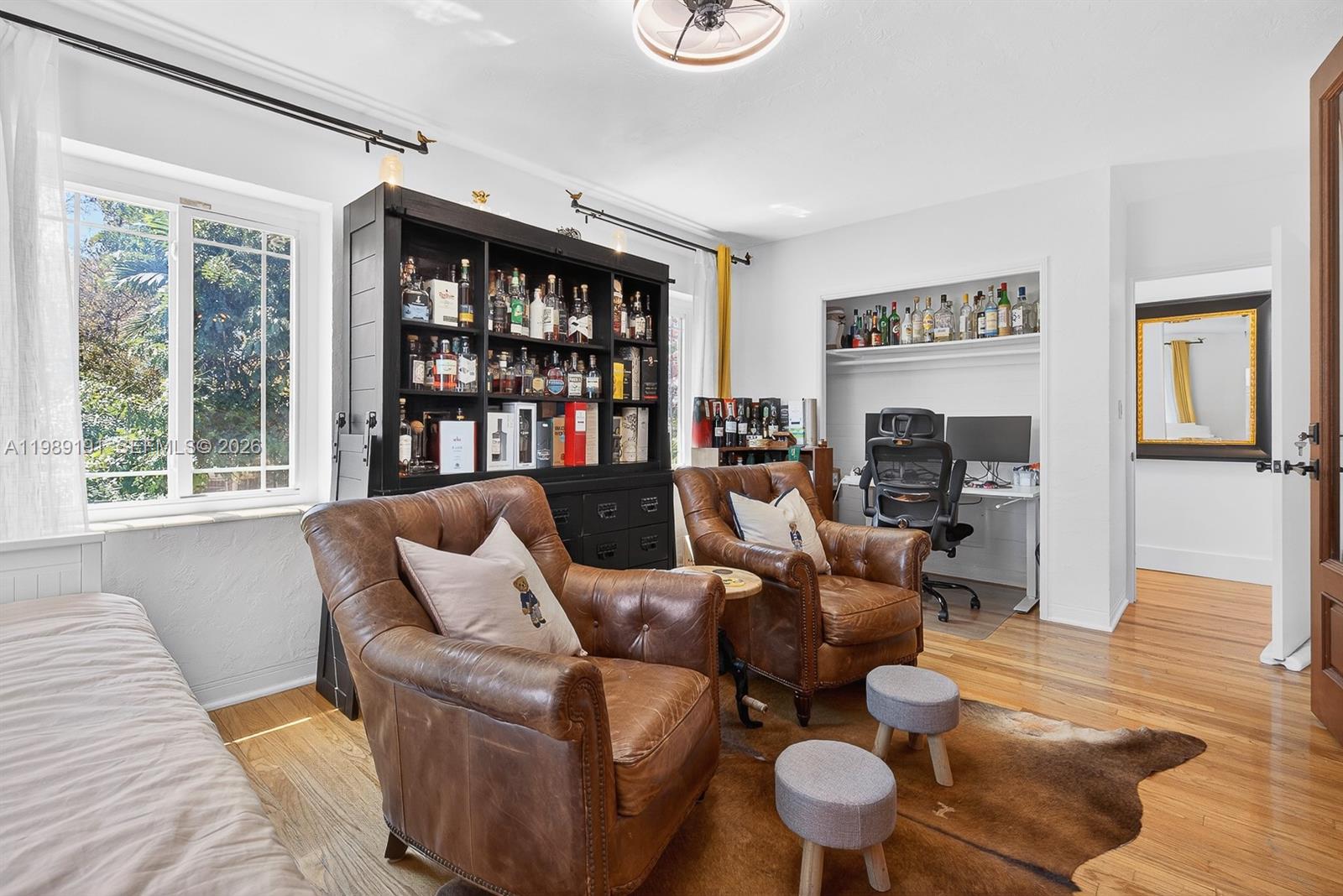 2431 Southwest 4th Street Miami, FL 33135 - Photo 26 of 33 a living room with furniture and a fireplace
