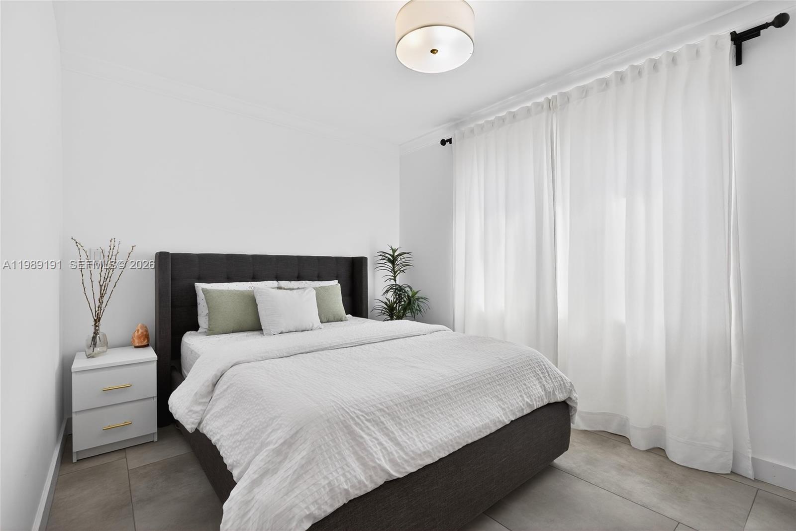 2431 Southwest 4th Street Miami, FL 33135 - Photo 7 of 33 a bedroom with a bed and a window