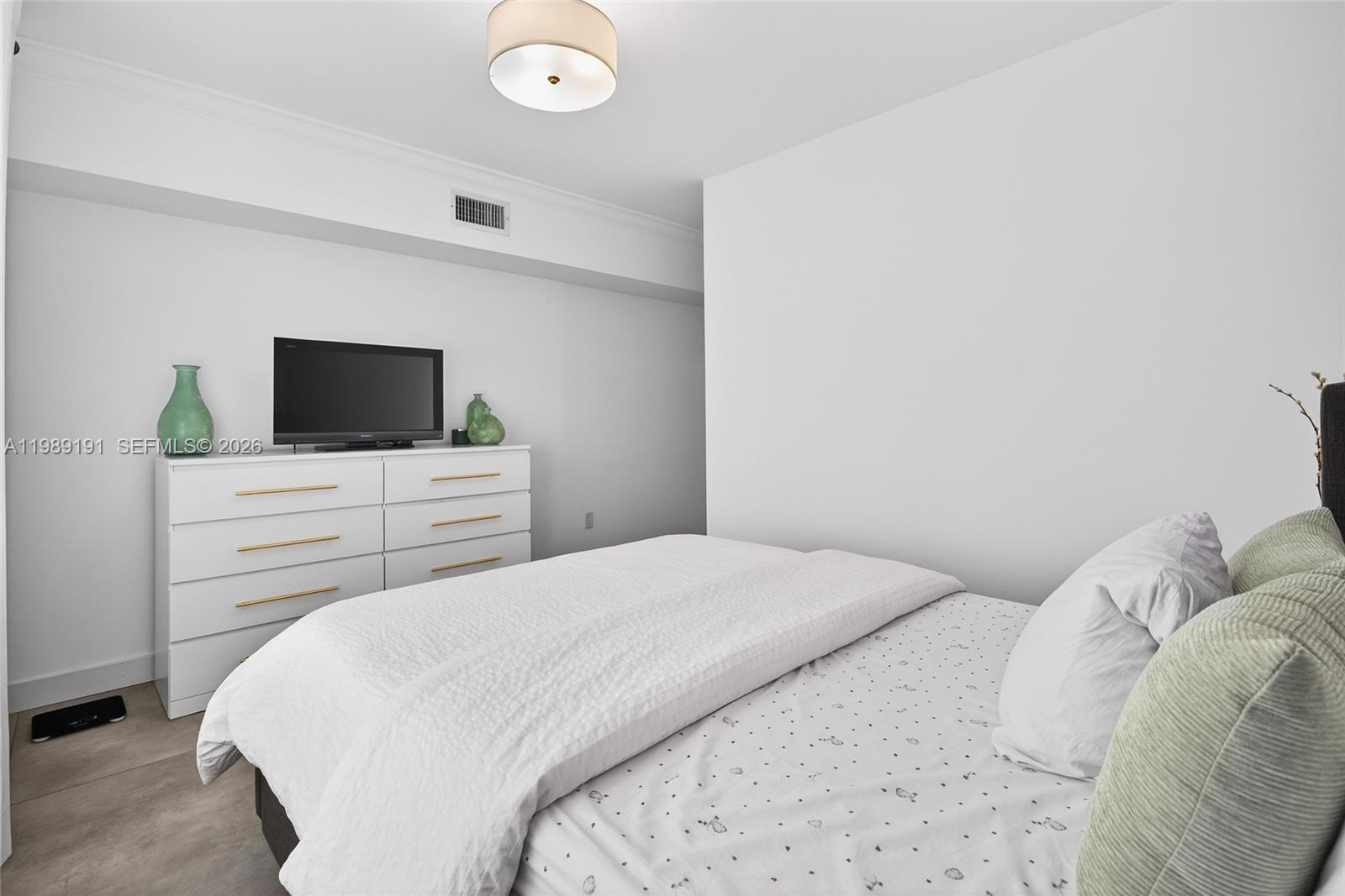 2431 Southwest 4th Street Miami, FL 33135 - Photo 8 of 33 a bedroom with a bed and a flat screen tv