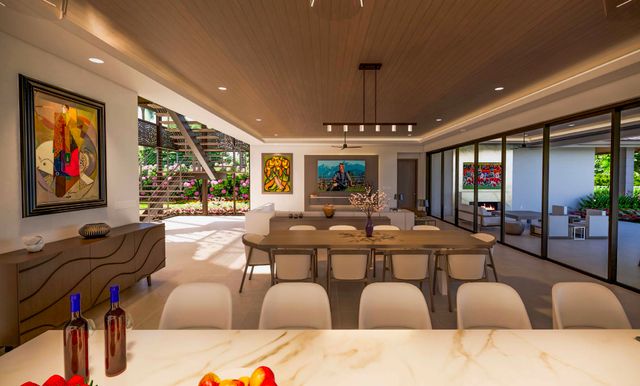 a living room with furniture a large window and kitchen view