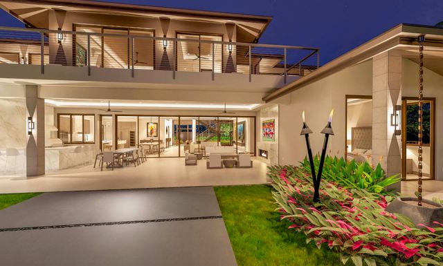 a view of a porch with chairs and potted plants