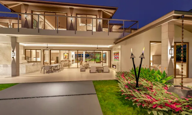 a view of a porch with chairs and potted plants