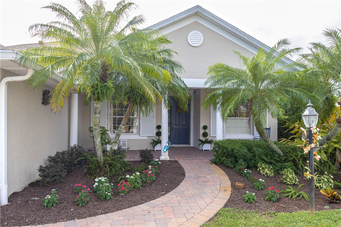 671 Gossamer Wing Way Sebastian, FL 32958 - Photo 1 of 36 a front view of a house with garden