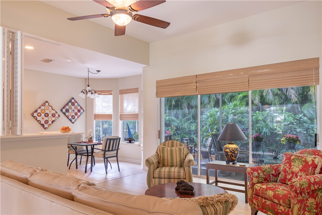 671 Gossamer Wing Way Sebastian, FL 32958 - Photo 12 of 36 a living room with furniture and a large window