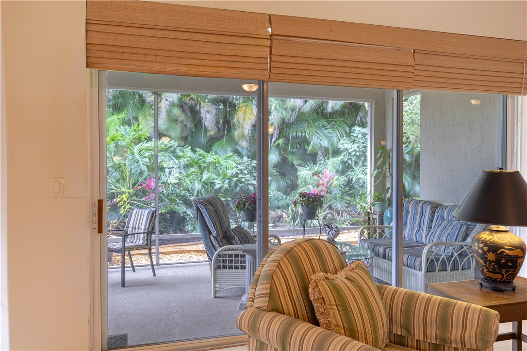671 Gossamer Wing Way Sebastian, FL 32958 - Photo 13 of 36 a living room with furniture and a floor to ceiling window