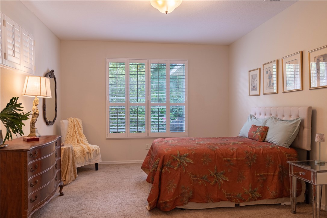 671 Gossamer Wing Way Sebastian, FL 32958 - Photo 19 of 36 a bedroom with a bed and a window