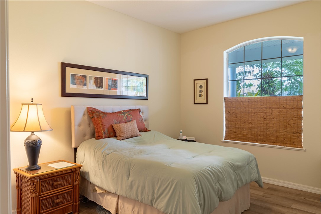 671 Gossamer Wing Way Sebastian, FL 32958 - Photo 21 of 36 a bedroom with a bed and a window