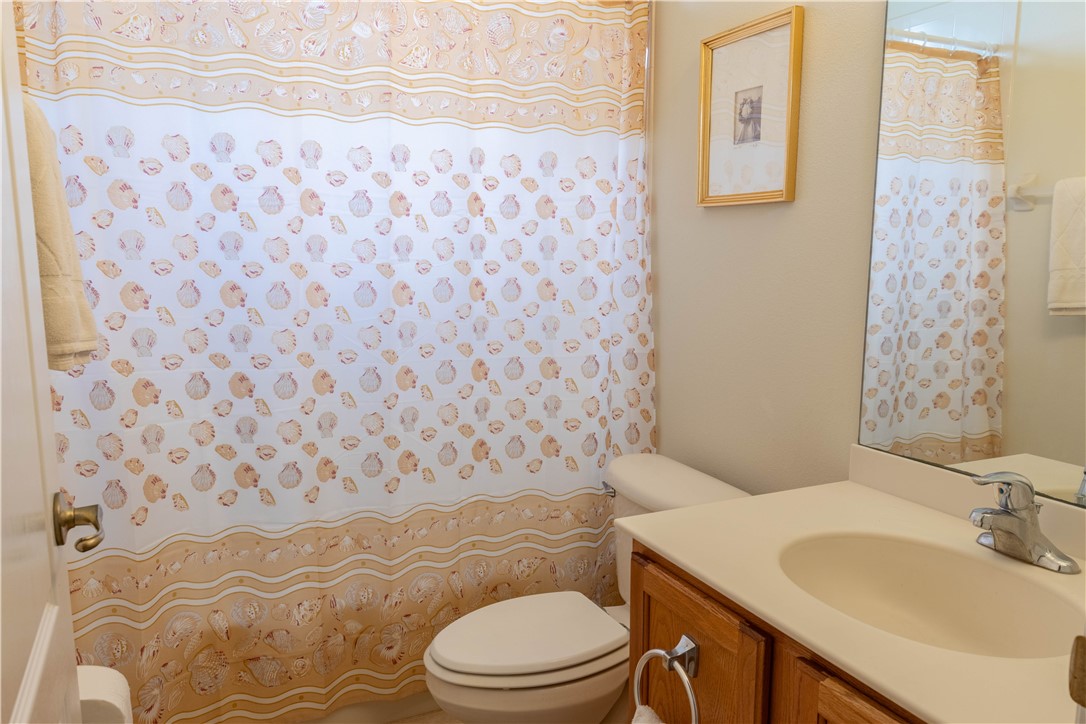 671 Gossamer Wing Way Sebastian, FL 32958 - Photo 26 of 36 a bathroom with a sink toilet and shower