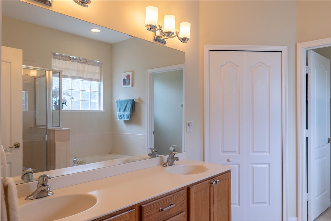 671 Gossamer Wing Way Sebastian, FL 32958 - Photo 27 of 36 a bathroom with a sink and a mirror
