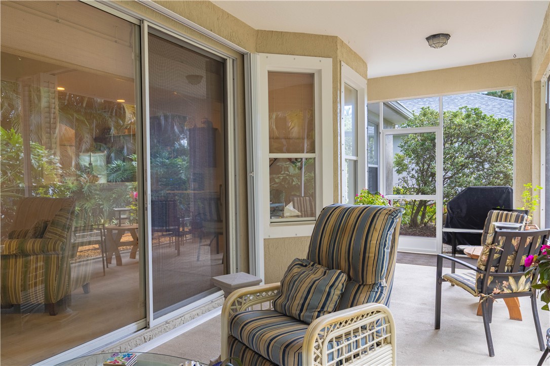 671 Gossamer Wing Way Sebastian, FL 32958 - Photo 32 of 36 a living room with furniture and a floor to ceiling window