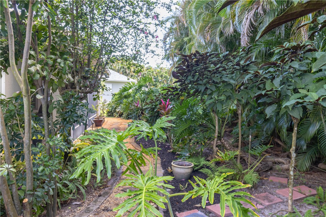 671 Gossamer Wing Way Sebastian, FL 32958 - Photo 34 of 36 a backyard of a house with lots of green space