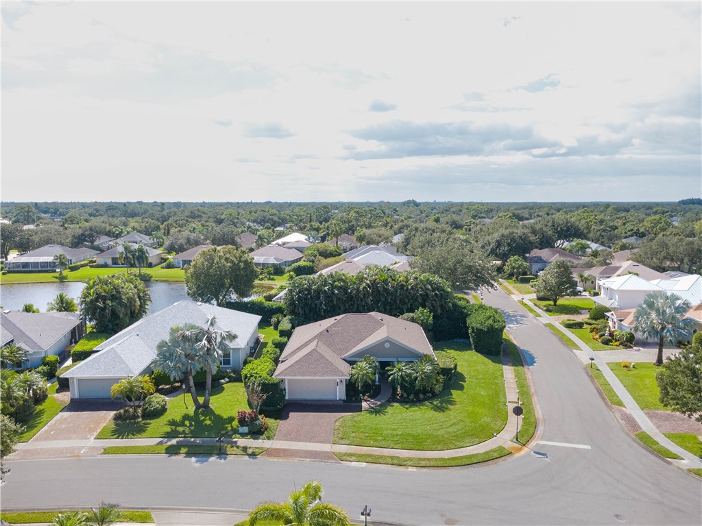 671 Gossamer Wing Way Sebastian, FL 32958 - Photo 35 of 36 an aerial view of a house with a garden and lake view
