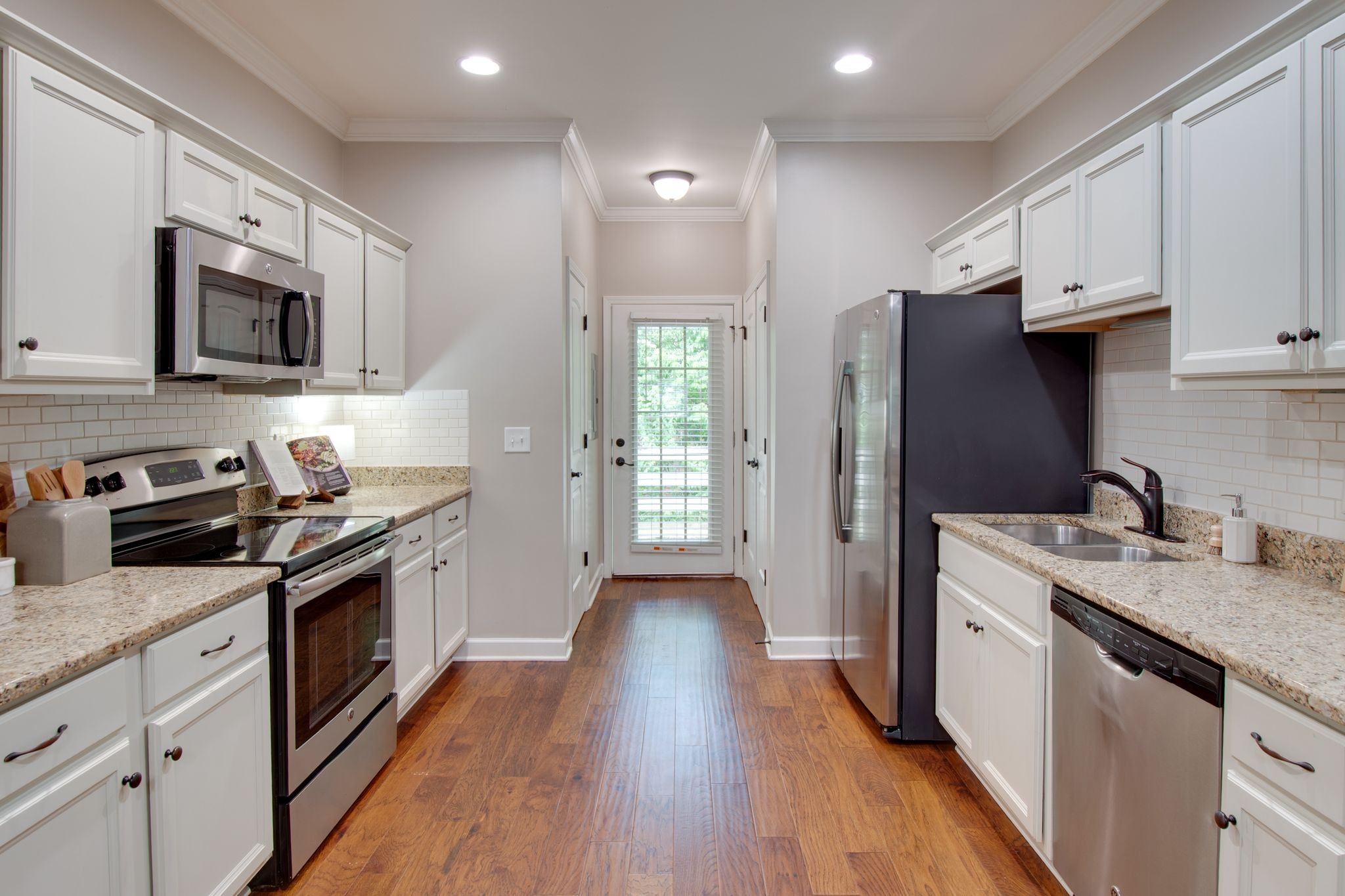 149 Velena Street Franklin, TN 37064 - Photo 15 of 27 a kitchen with a sink stove and refrigerator