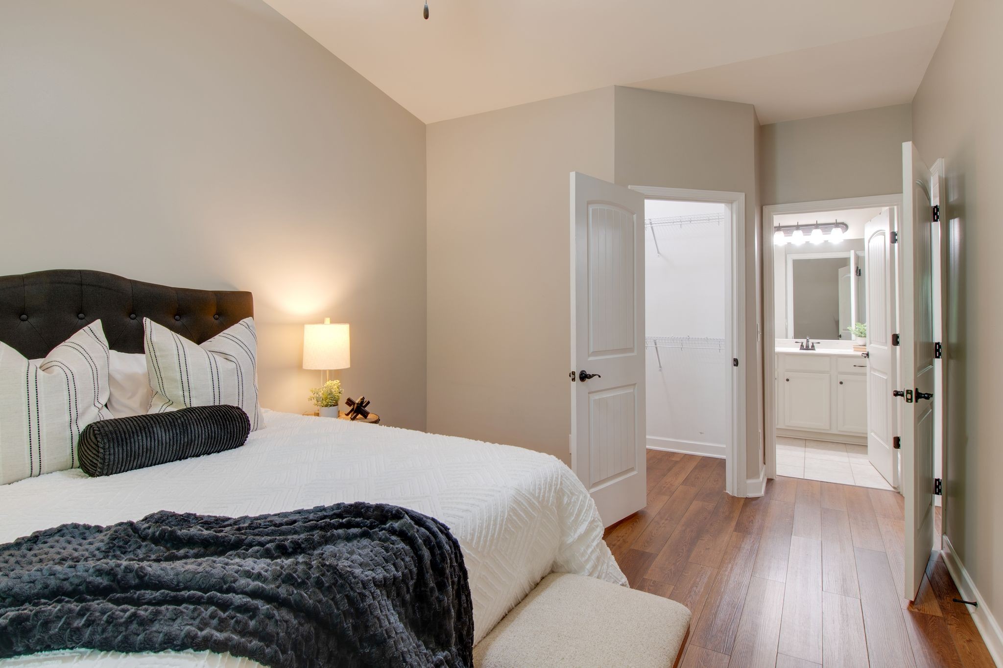 149 Velena Street Franklin, TN 37064 - Photo 18 of 27 a bedroom with a bed and wooden floor