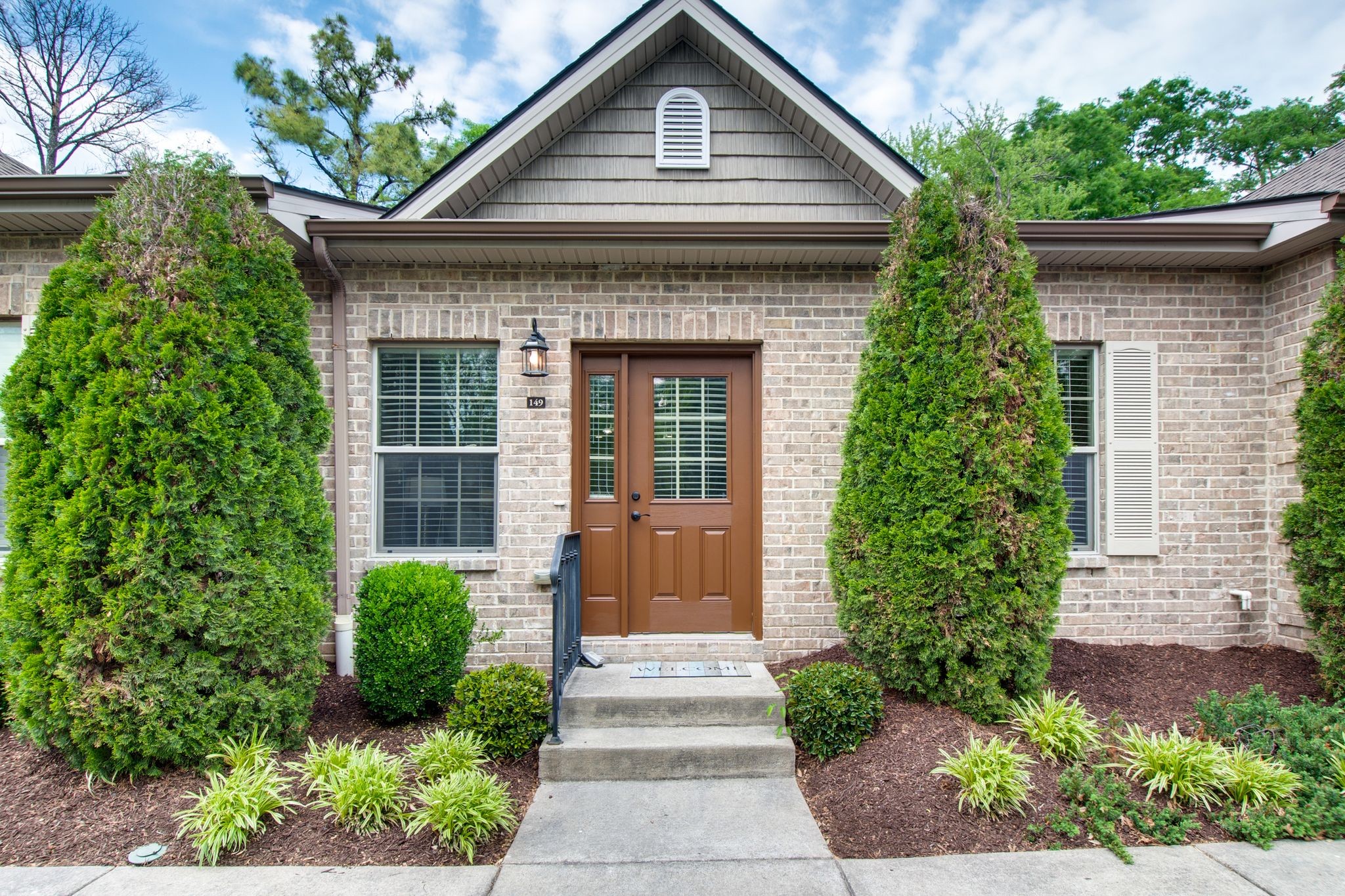 149 Velena Street Franklin, TN 37064 - Photo 2 of 27 a front view of a house with a yard and potted plants