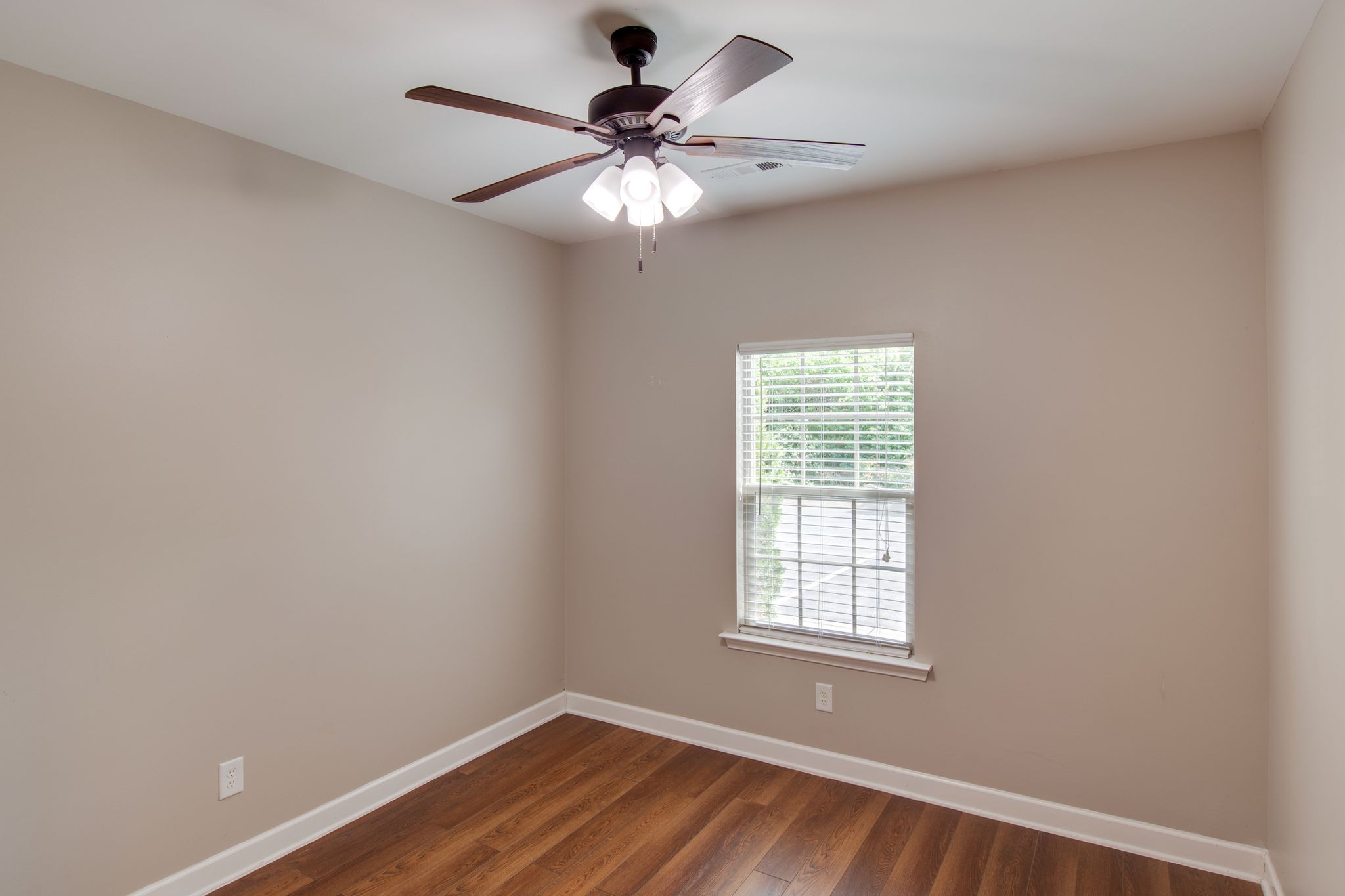 149 Velena Street Franklin, TN 37064 - Photo 22 of 27 a view of an empty room with wooden floor and a window