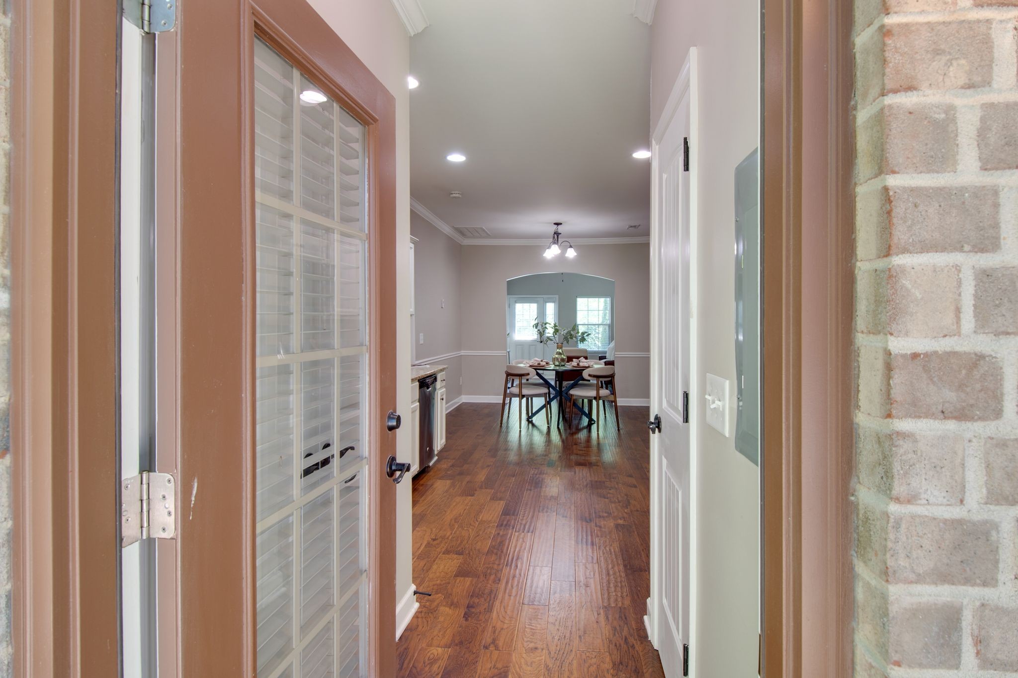 149 Velena Street Franklin, TN 37064 - Photo 23 of 27 a view of a livingroom and a dining room with furniture wooden floor and a window