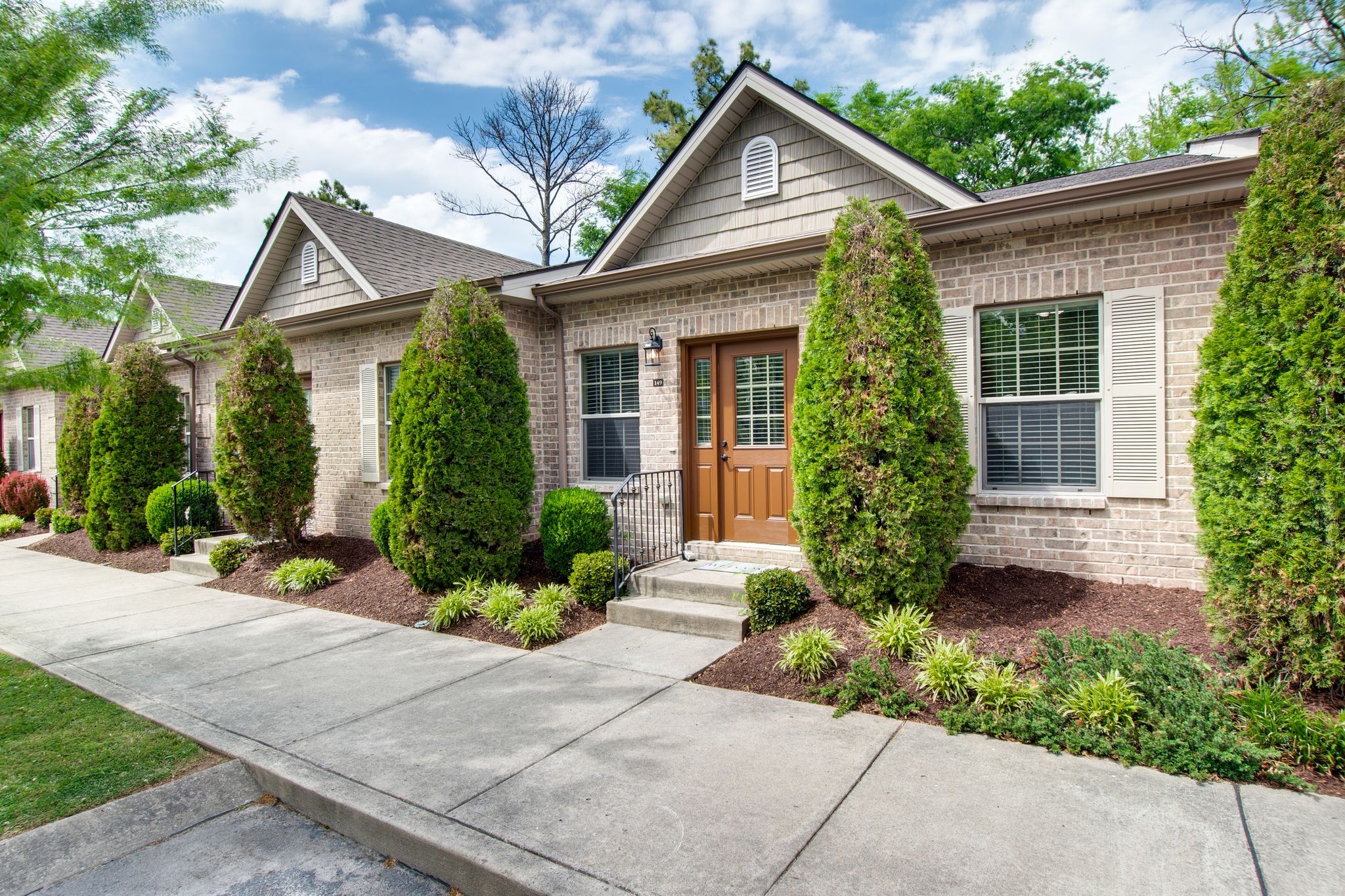149 Velena Street Franklin, TN 37064 - Photo 3 of 27 a front view of a house with a yard and potted plants