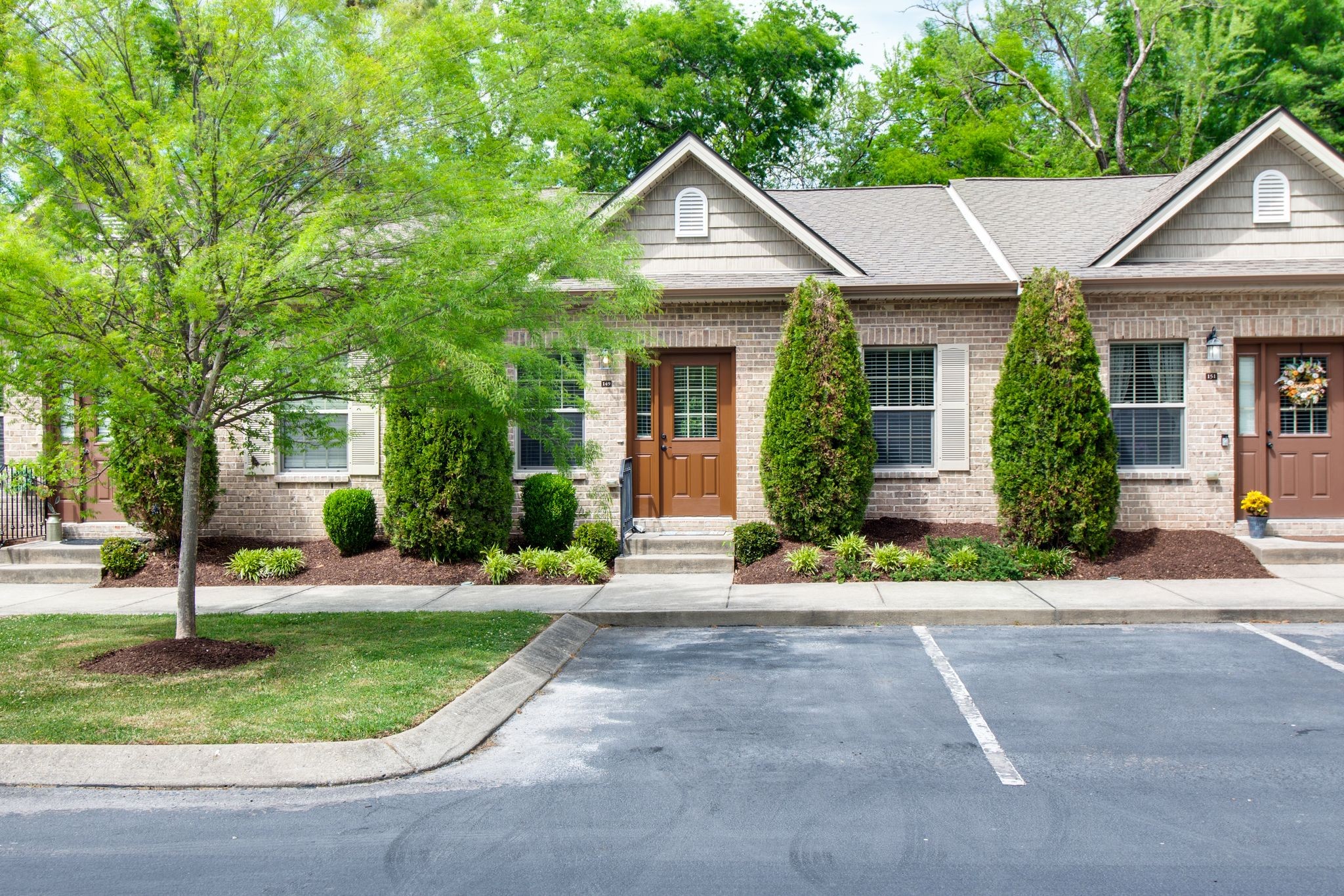 149 Velena Street Franklin, TN 37064 - Photo 4 of 27 a front view of a house with a yard and potted plants