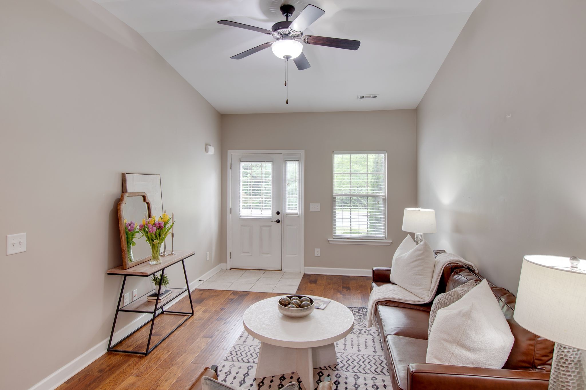 149 Velena Street Franklin, TN 37064 - Photo 6 of 27 a living room with furniture and a chandelier