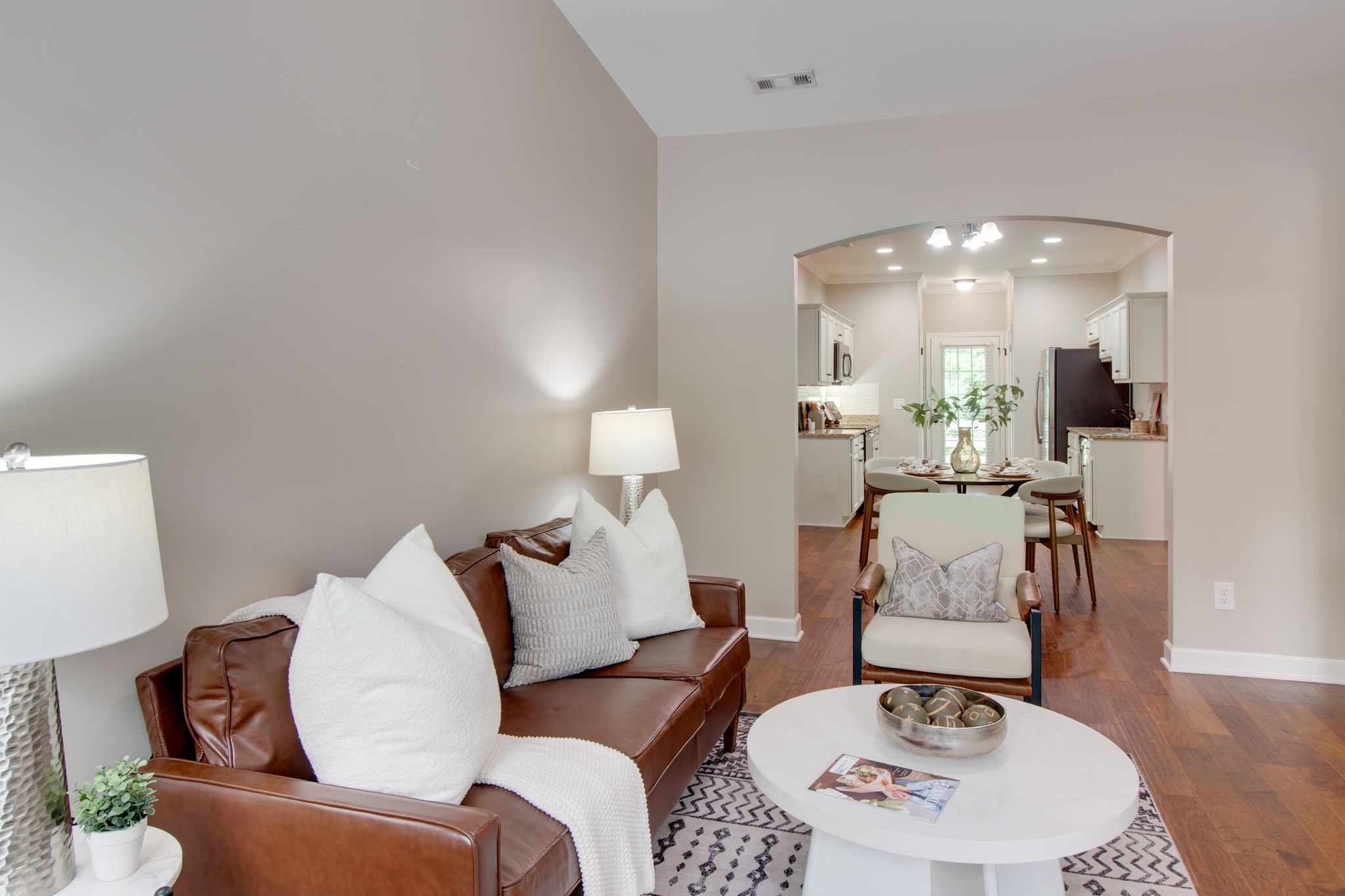 149 Velena Street Franklin, TN 37064 - Photo 8 of 27 a living room with furniture and a dining table