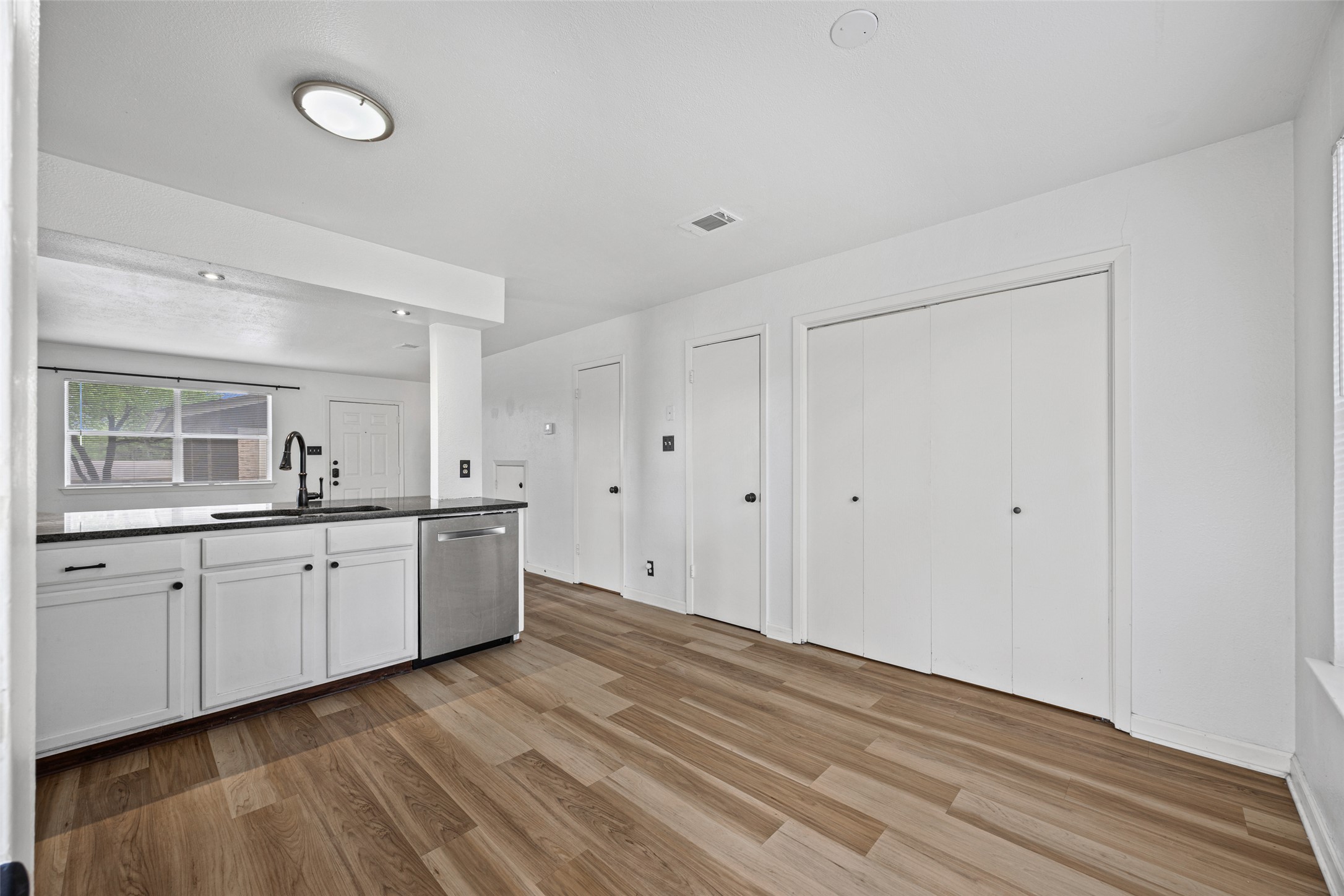 8100 Dunn Street, Unit B Austin, TX 78745 - Photo 12 of 29 a large white room with mirror and vanity