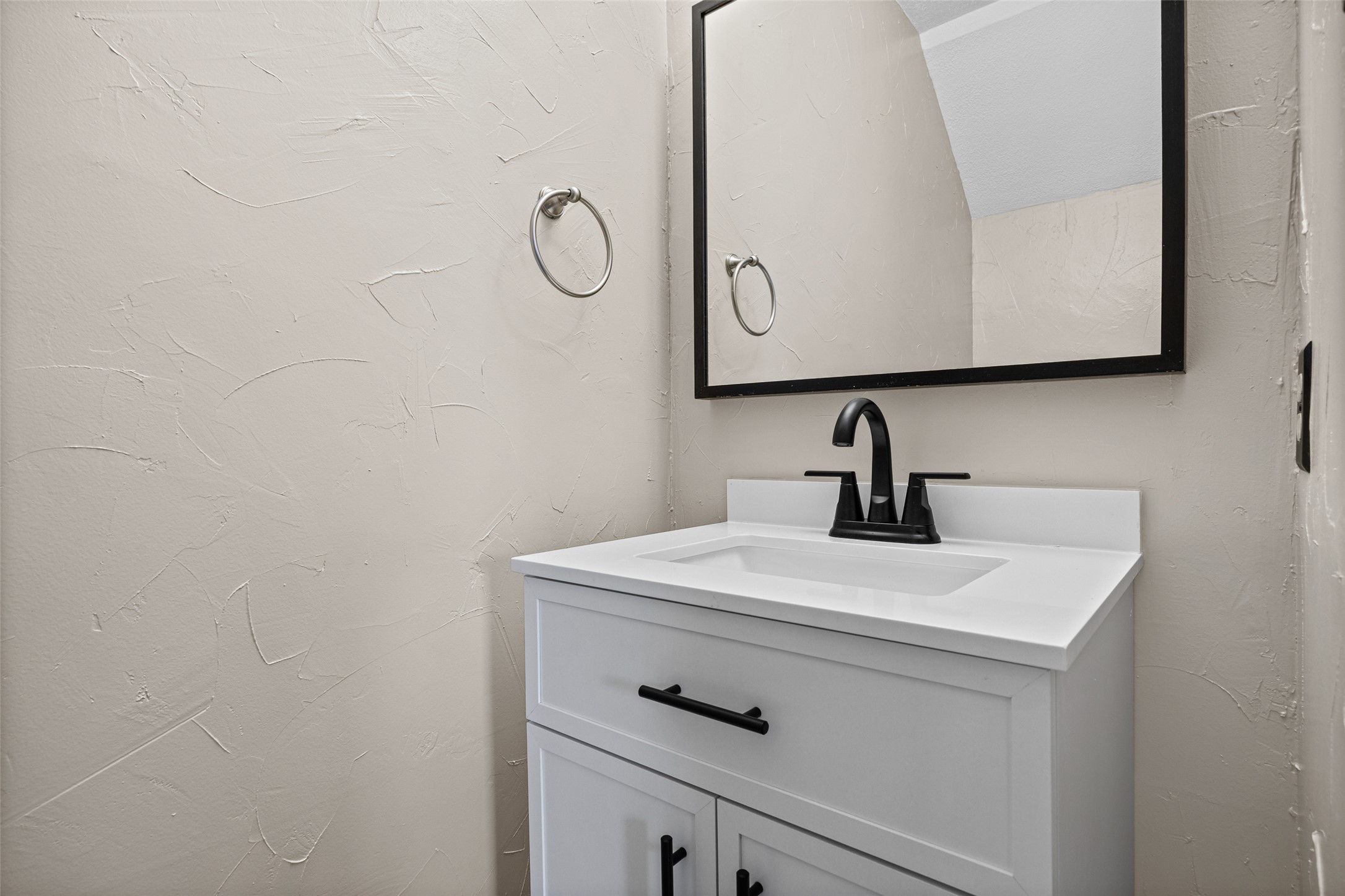 8100 Dunn Street, Unit B Austin, TX 78745 - Photo 15 of 29 a close view of a sink in a bathroom mirror