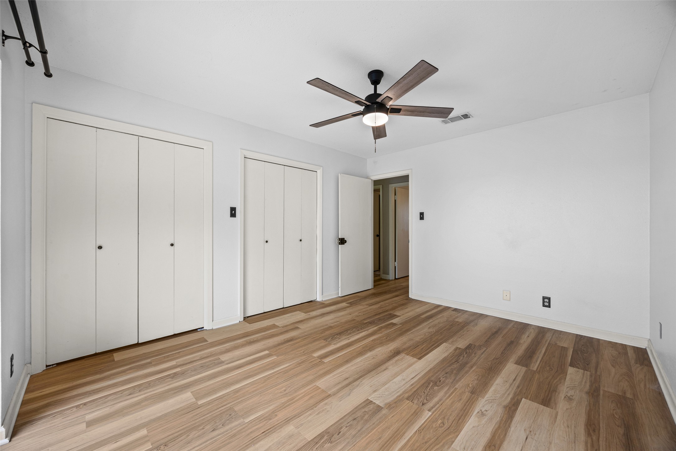 8100 Dunn Street, Unit B Austin, TX 78745 - Photo 20 of 29 a view of empty room with wooden floor