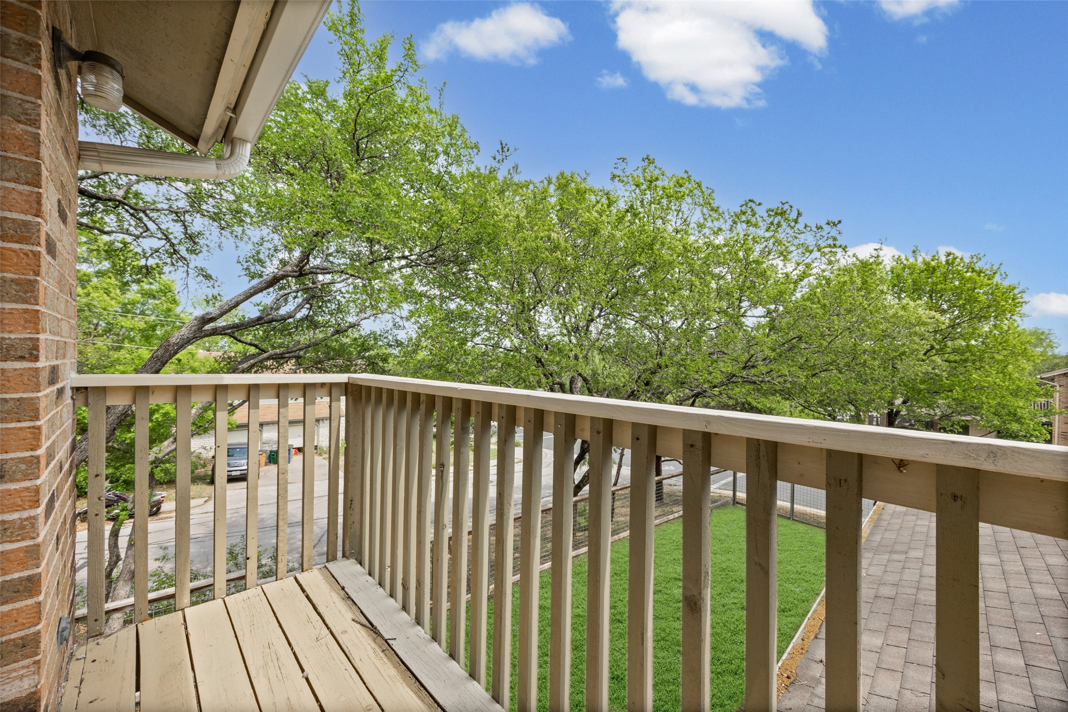 8100 Dunn Street, Unit B Austin, TX 78745 - Photo 22 of 29 a view of a balcony with wooden floor