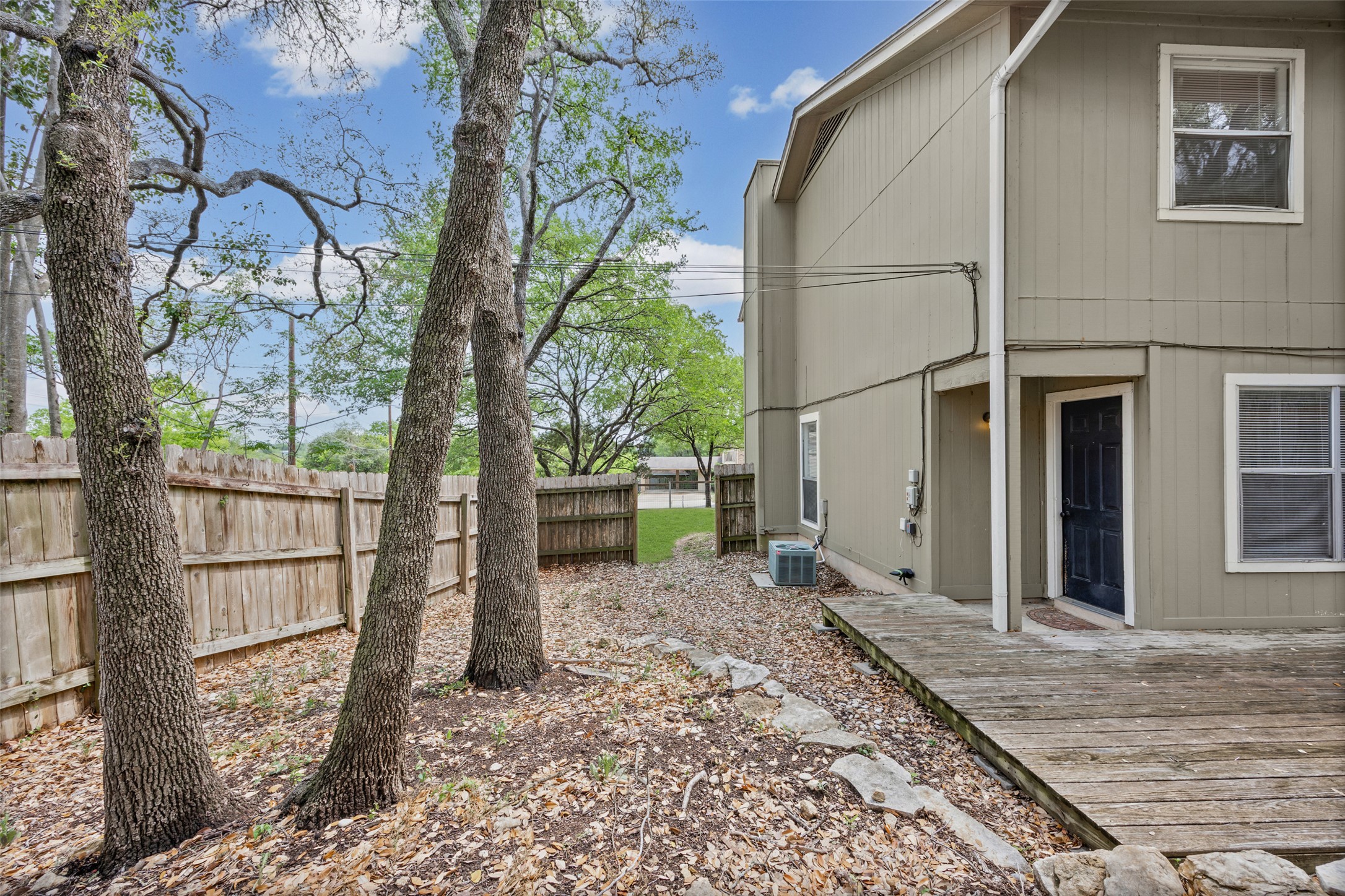 8100 Dunn Street, Unit B Austin, TX 78745 - Photo 25 of 29 a backyard of a house with lots of green space