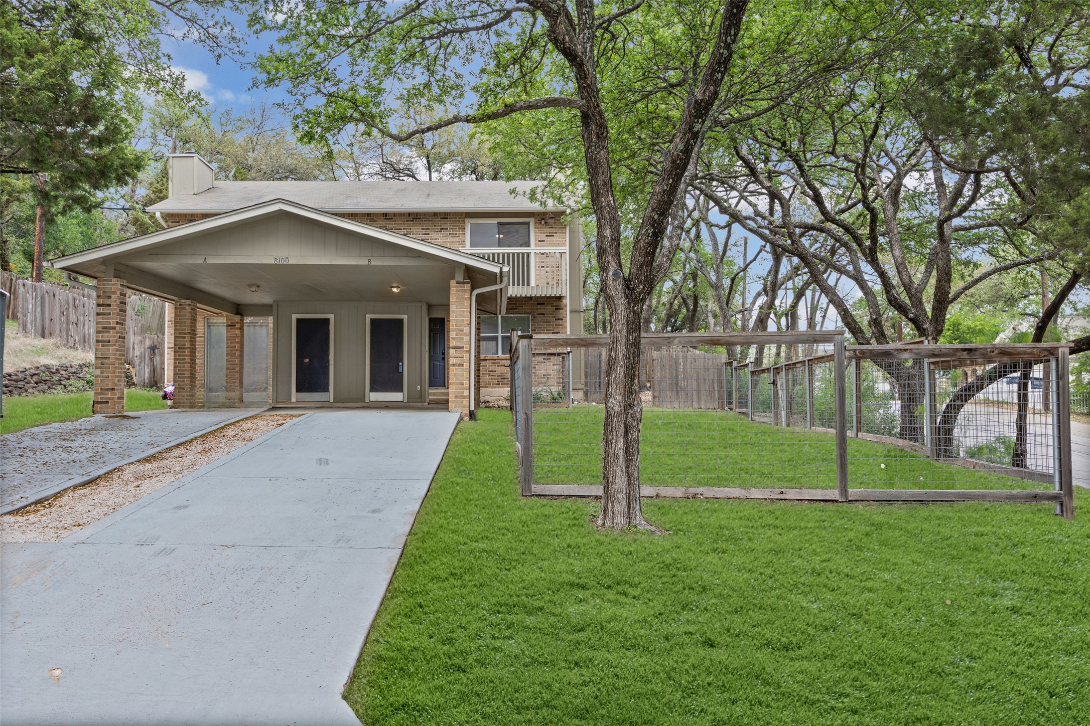 8100 Dunn Street, Unit B Austin, TX 78745 - Photo 3 of 29 a view of a house with a yard and tree s