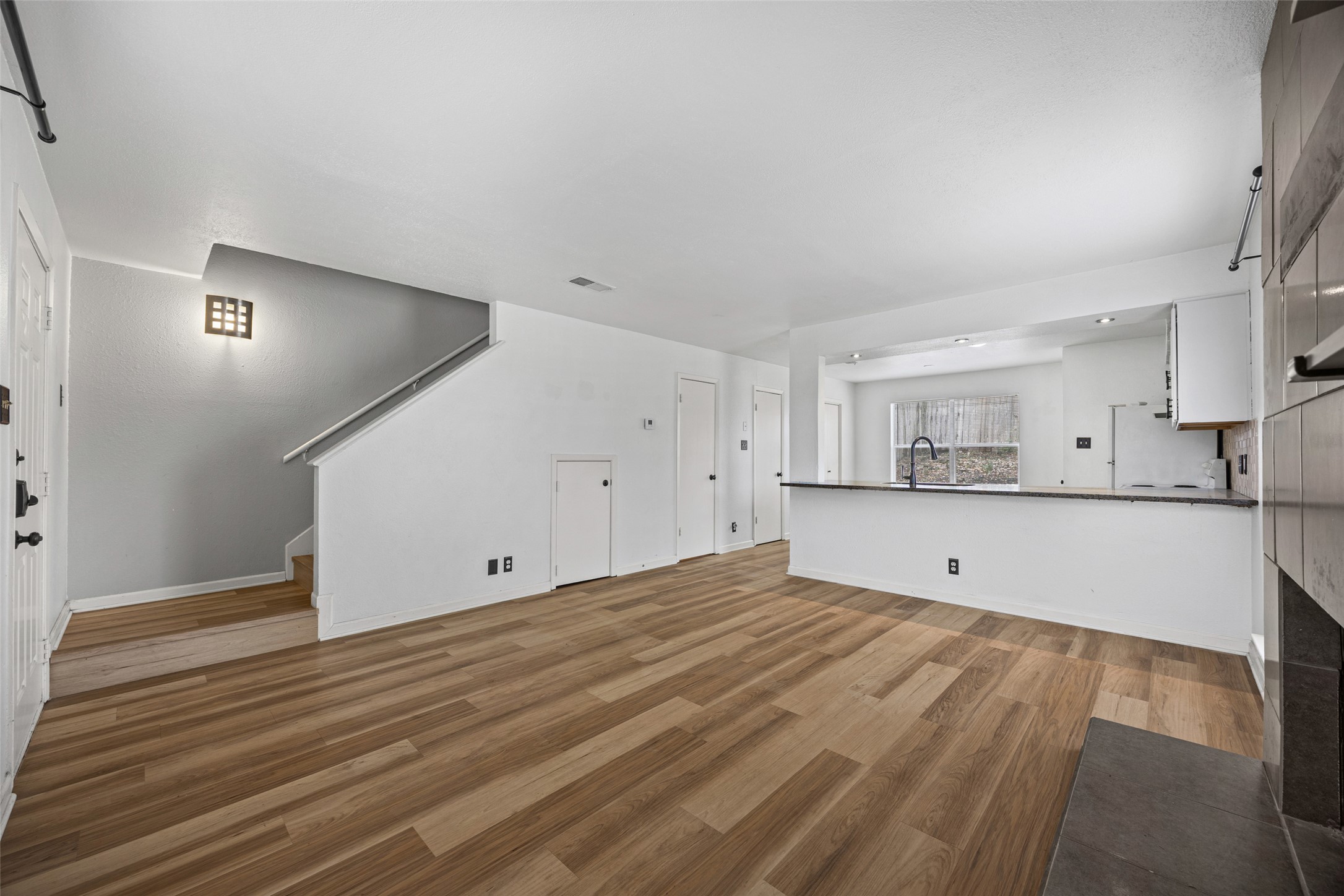 8100 Dunn Street, Unit B Austin, TX 78745 - Photo 7 of 29 a view of kitchen with wooden floor