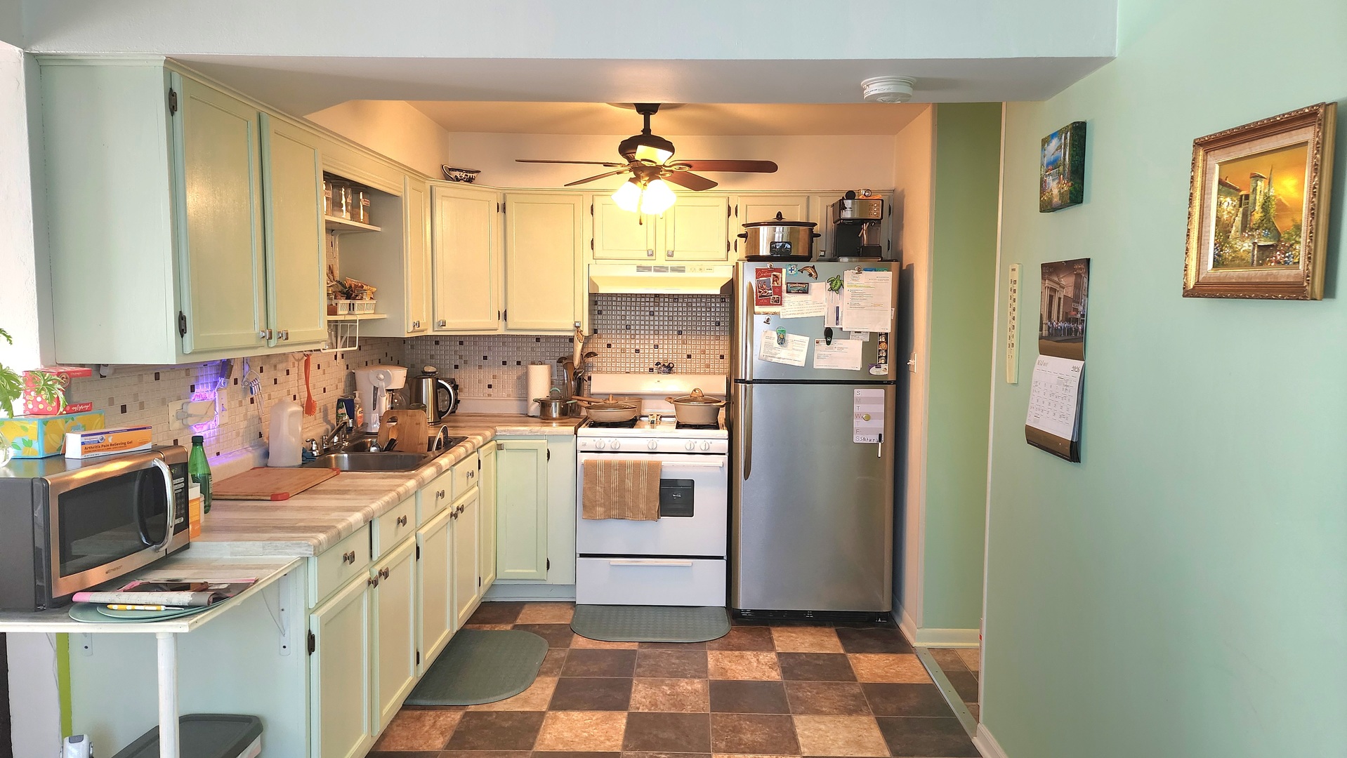 8125 South Roberts Road Bridgeview, IL 60455 - Photo 8 of 11 a kitchen with a refrigerator a sink and a stove