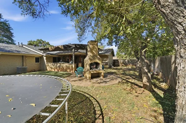 a view of a backyard with a trees
