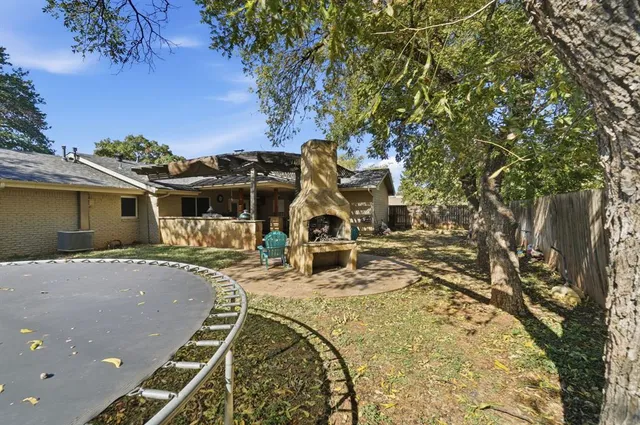 a view of a backyard with a trees