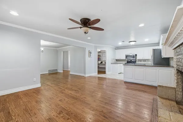 a view of kitchen with wooden floor and window